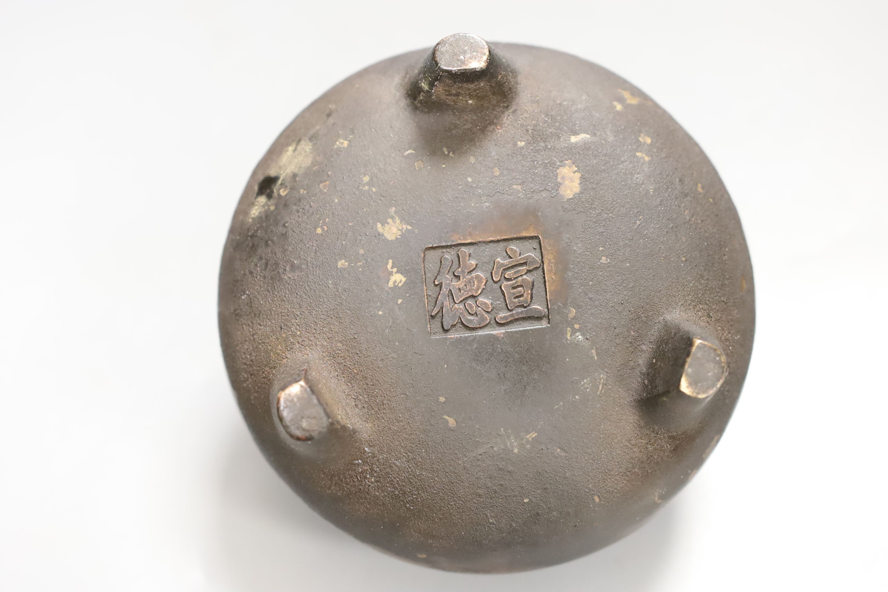 A Chinese bronze tripod censer, Xuande mark, 14 cm wide